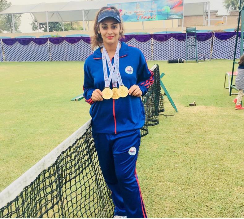 Ushna Suhail, Pakistan women's tennis player in tennis court with medals