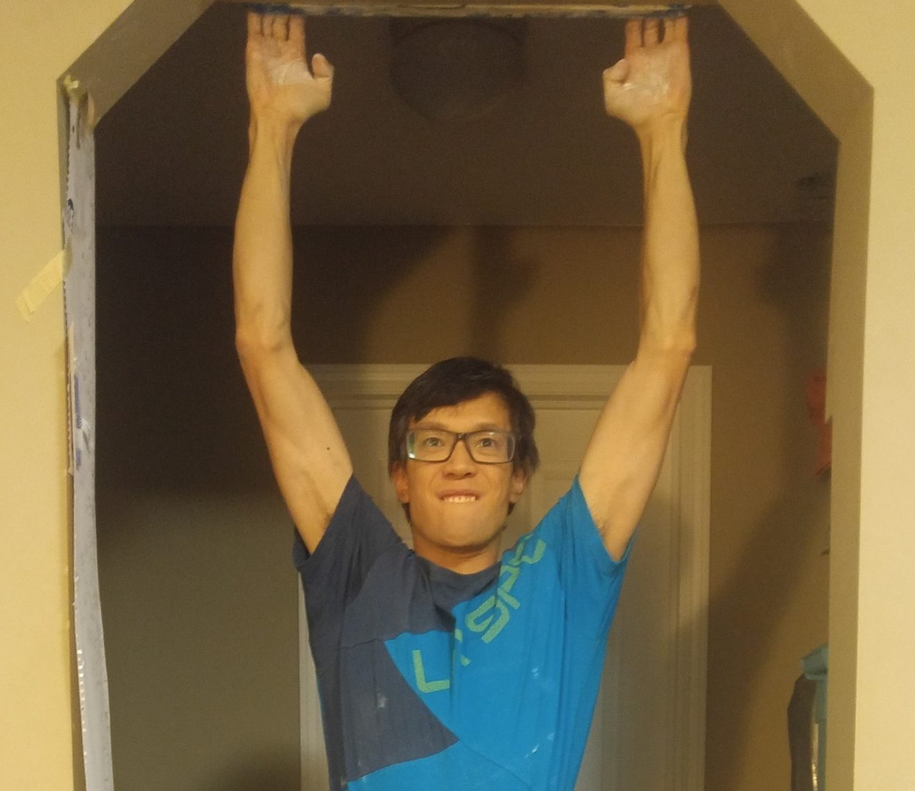 Evan Hau uses a fingerboard at home