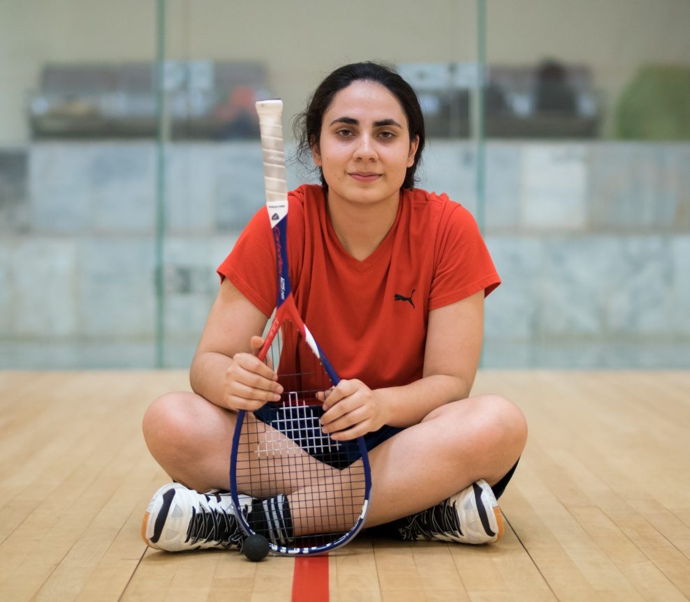 Noorena Shams, Pakistan squash player poses with her racket 