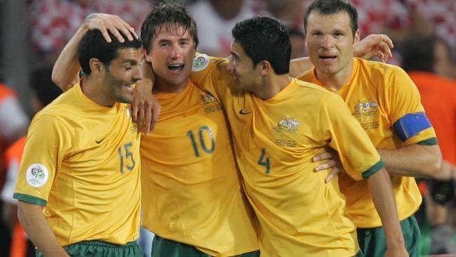 Harry Kewell Tim Cahill and Mark Viduka celebrate a Socceroos Goal in football