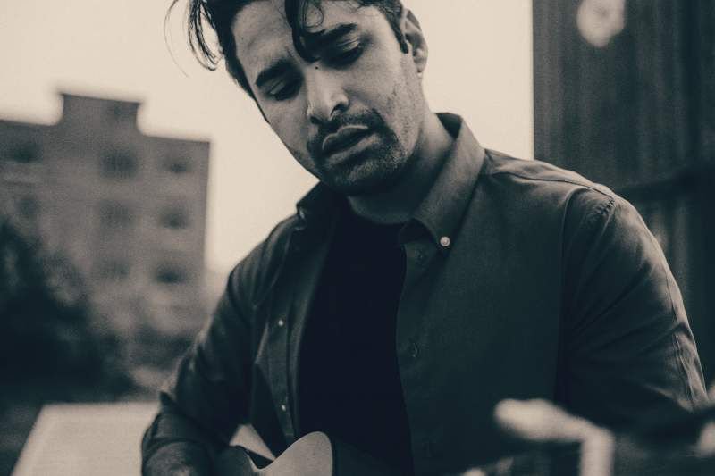 Bilal Ali of Kashmir Band in Pakistan strums a guitar