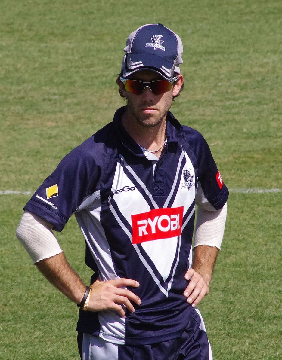 Glenn Maxwell stands on the field for his local team