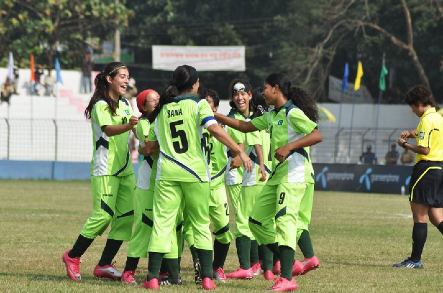 The Pakistan women's football team and celebrating a goal