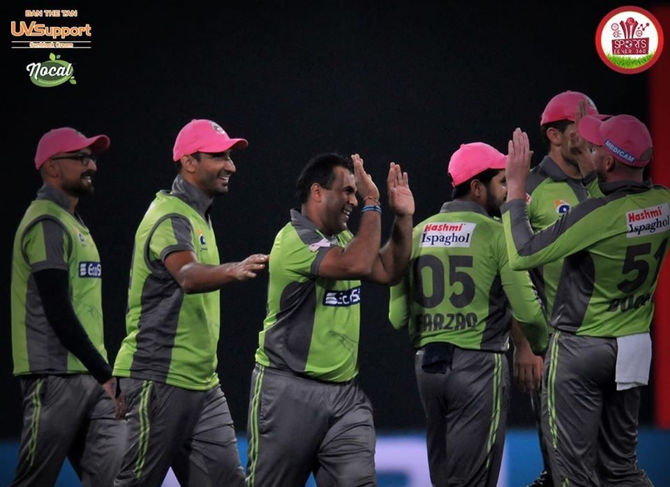 Lahore Qalandars celebrate a wicket with high-fives in the PSL