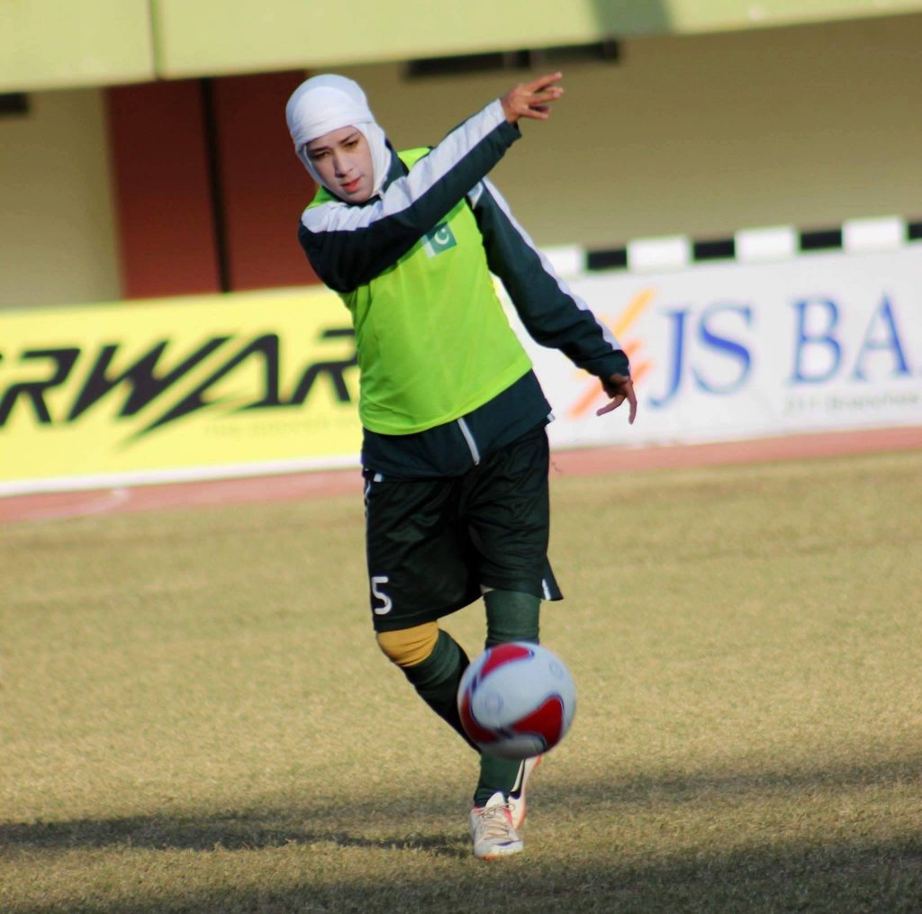 abiha haider throwing football during match AFL