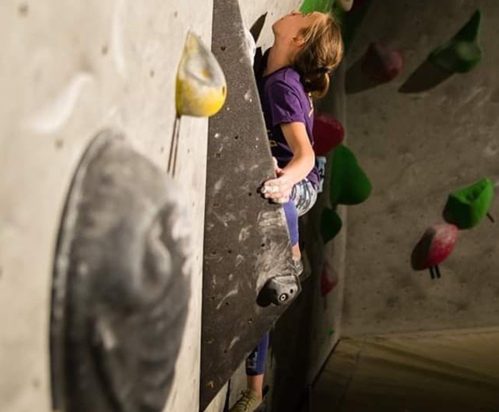 woman climbing on practical wall indoor croatia