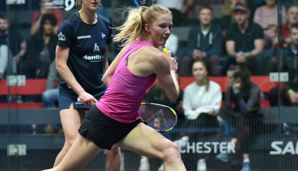 female squash player hitting a shot during match Canada