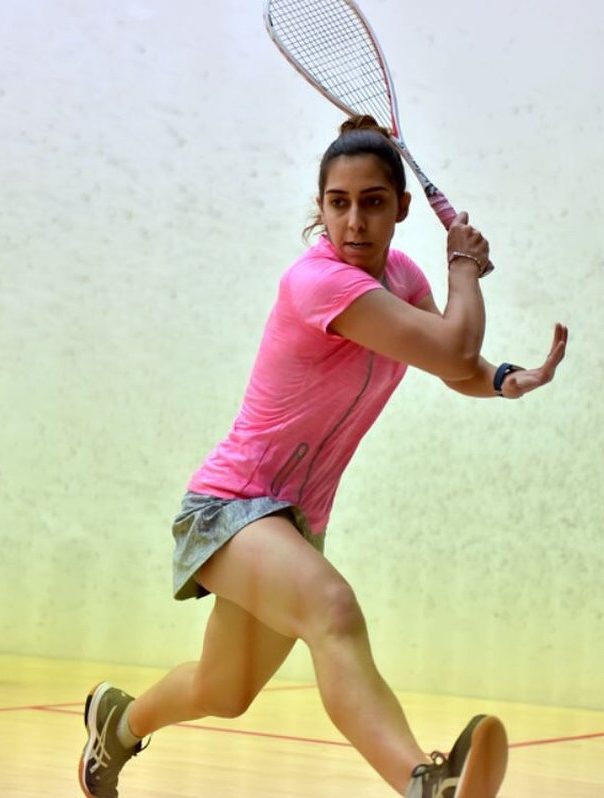 Nadine Shahin hitting a backhand shot during a match