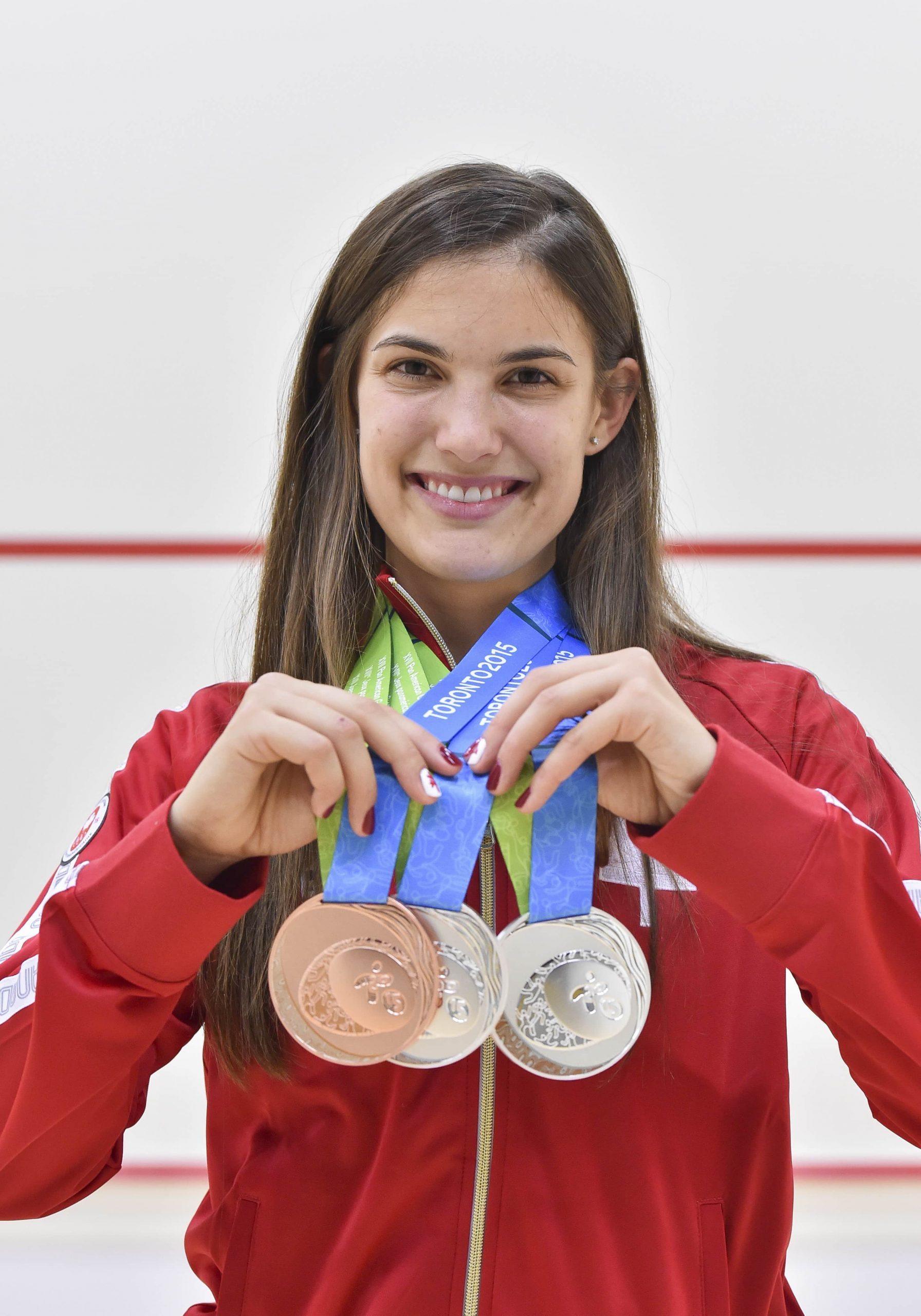 Samantha Cornett with her winning medals (World Squash Day)