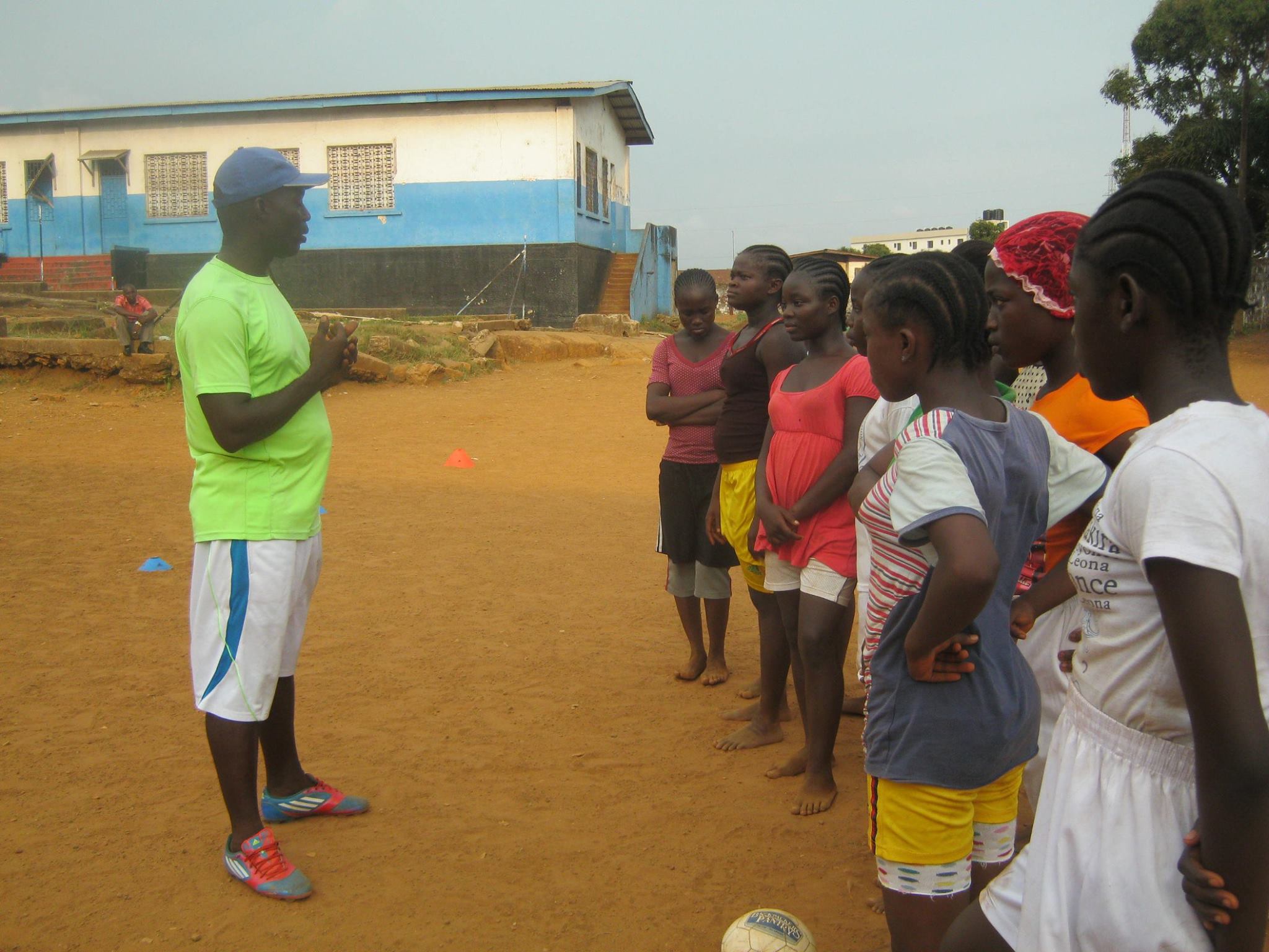 Pappie Jones coaching the youth with Soccer Ambassadors Liberia
