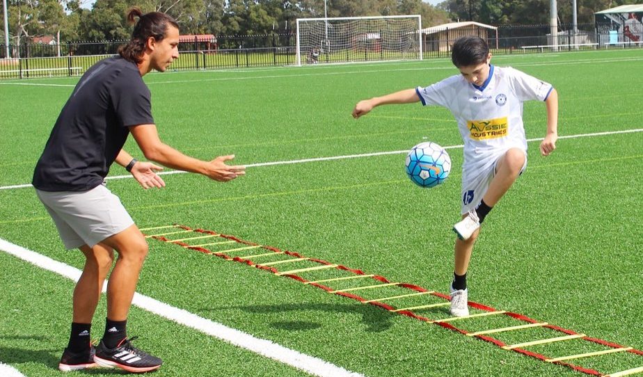 James training how to drill while passing,Treiner Australia