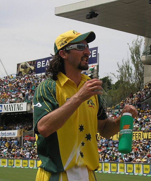 Jason Gillespie holding a water bottle, former Australian Aboriginal cricket player
