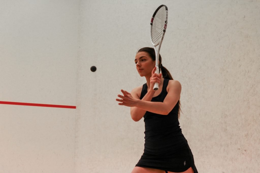 Chloe Kalvo hits the ball with squash racket,Norway