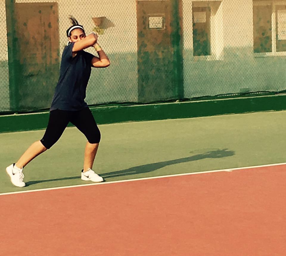 Ushna Suhail hitting a tennis shot