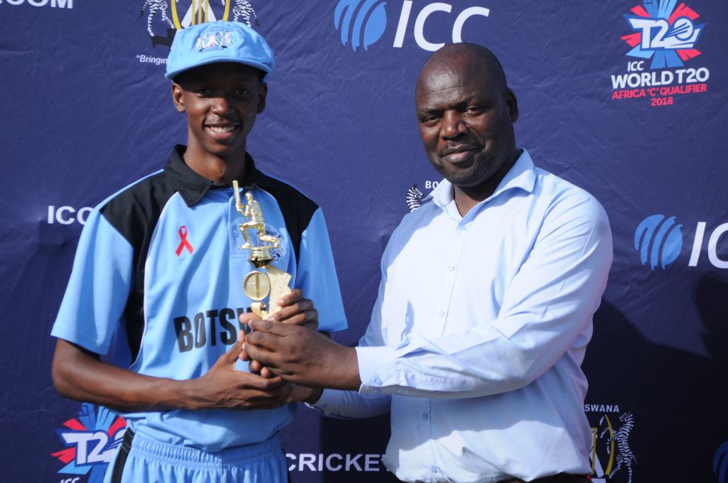 Phaswana, in his national cricketing gear receives a trophy