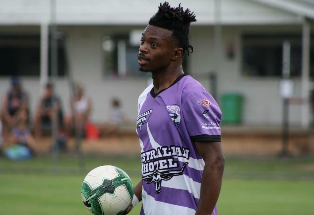 James Craig holding a ball for Grafton FC