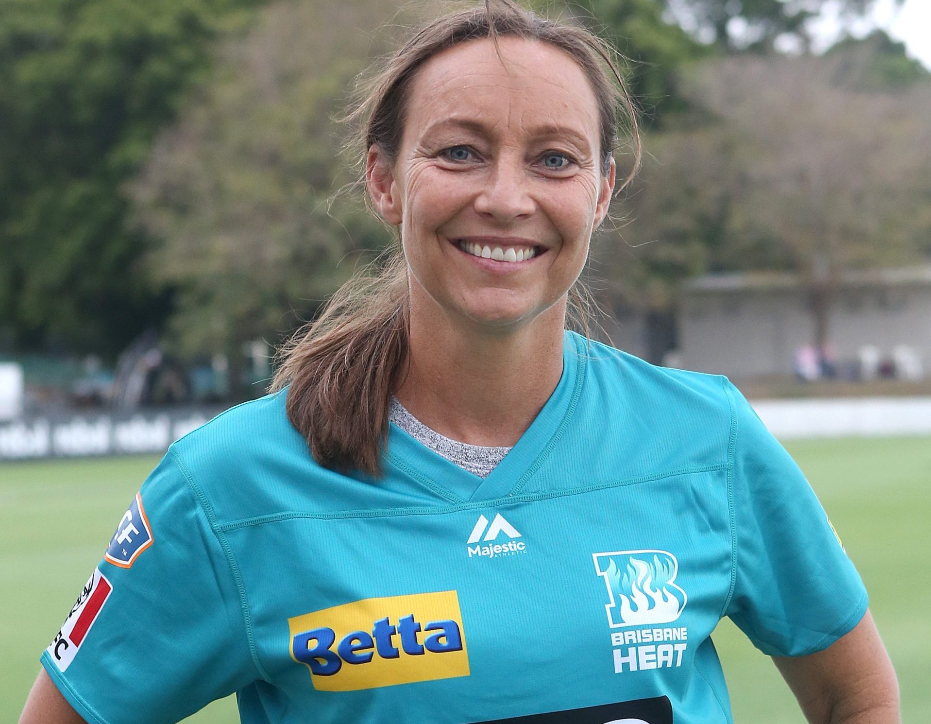 Julia Price smiles in her Brisbane Heat BBL kit