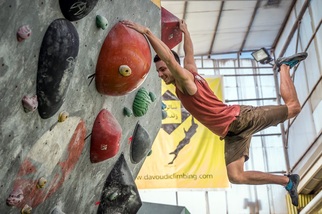 Heydari in motion! Hamed Heyderi climbs a wall