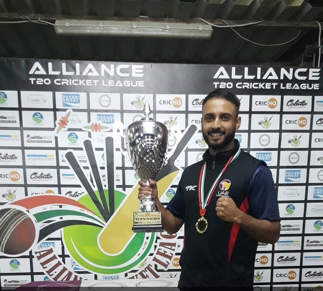 Abdullah Ghazi holding a trophy at Alliance T20 Cricket League in the UAE