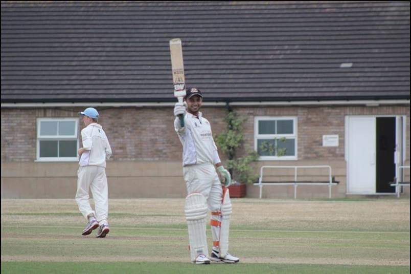 Abdullah Ghazi waving his bat during a criket match in the UAE