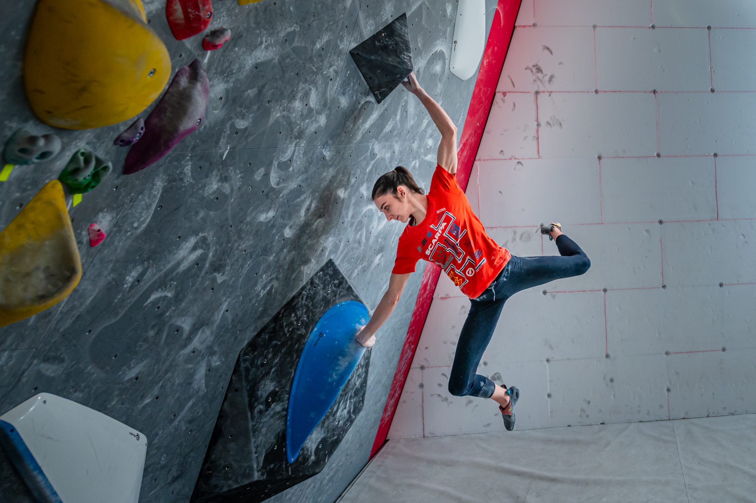 Mia Krampl hoists herself up the wall she is climbing Mia Krampl hoists herself up the wall she is climbing